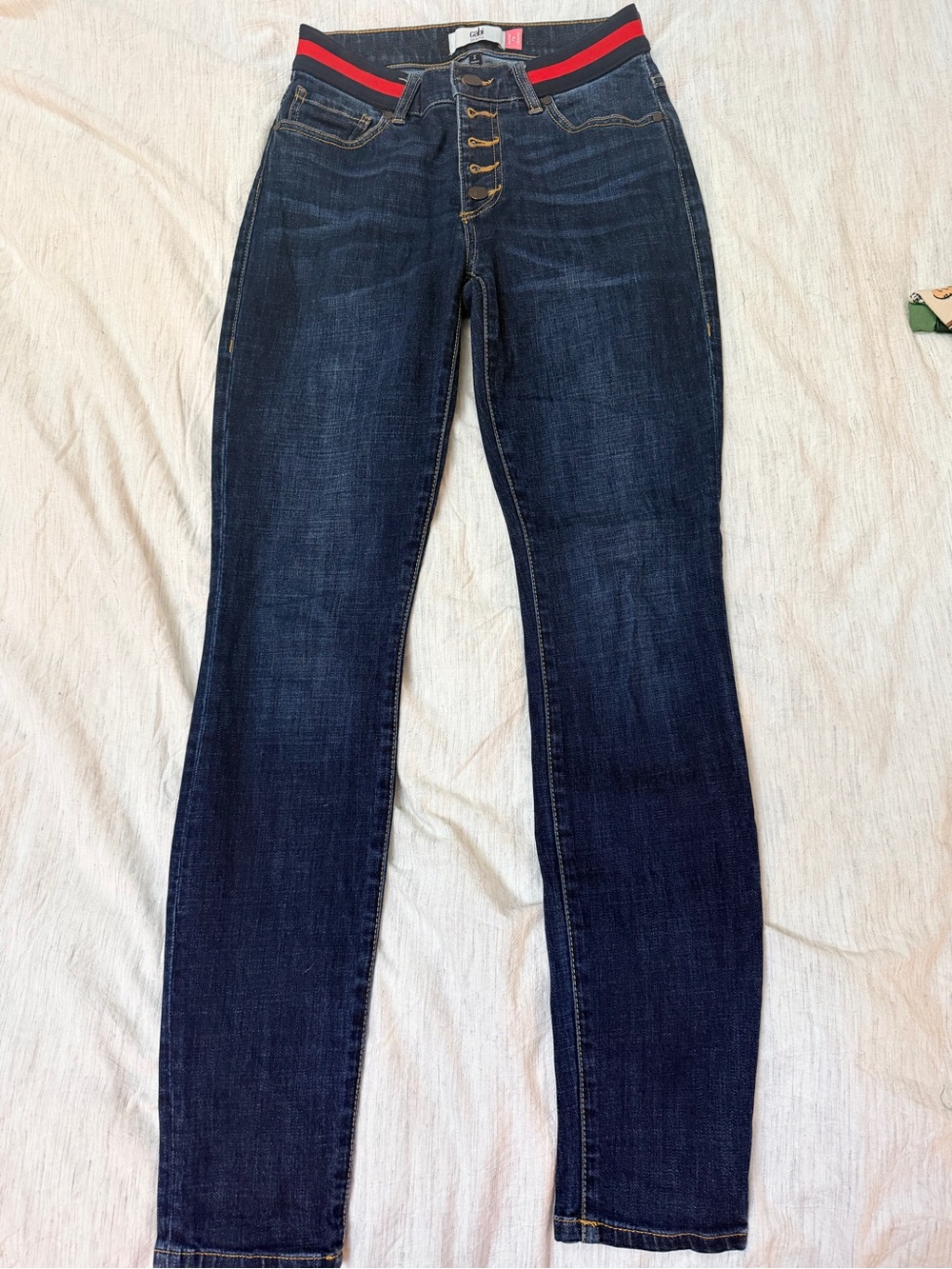 CAbi Dark Wash Skinny Jeans with Red and Black Waistband